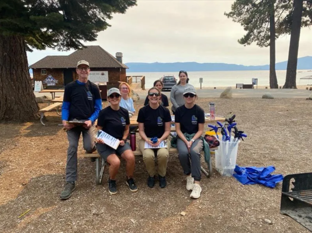Cleaning up the beach at Meeks Bay Resort